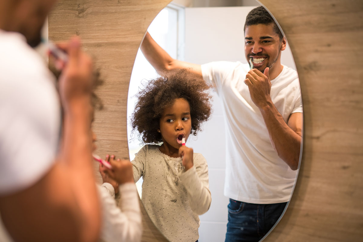 how to prevent tooth decay (2) father and daughter brushing teeth, how to prevent tooth decay naturally