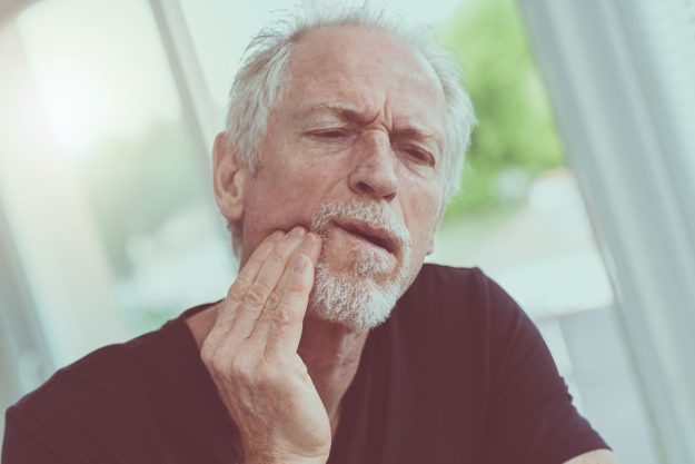 how does tooth decay develop (4) older man holding jaw wondering how does tooth decay develop