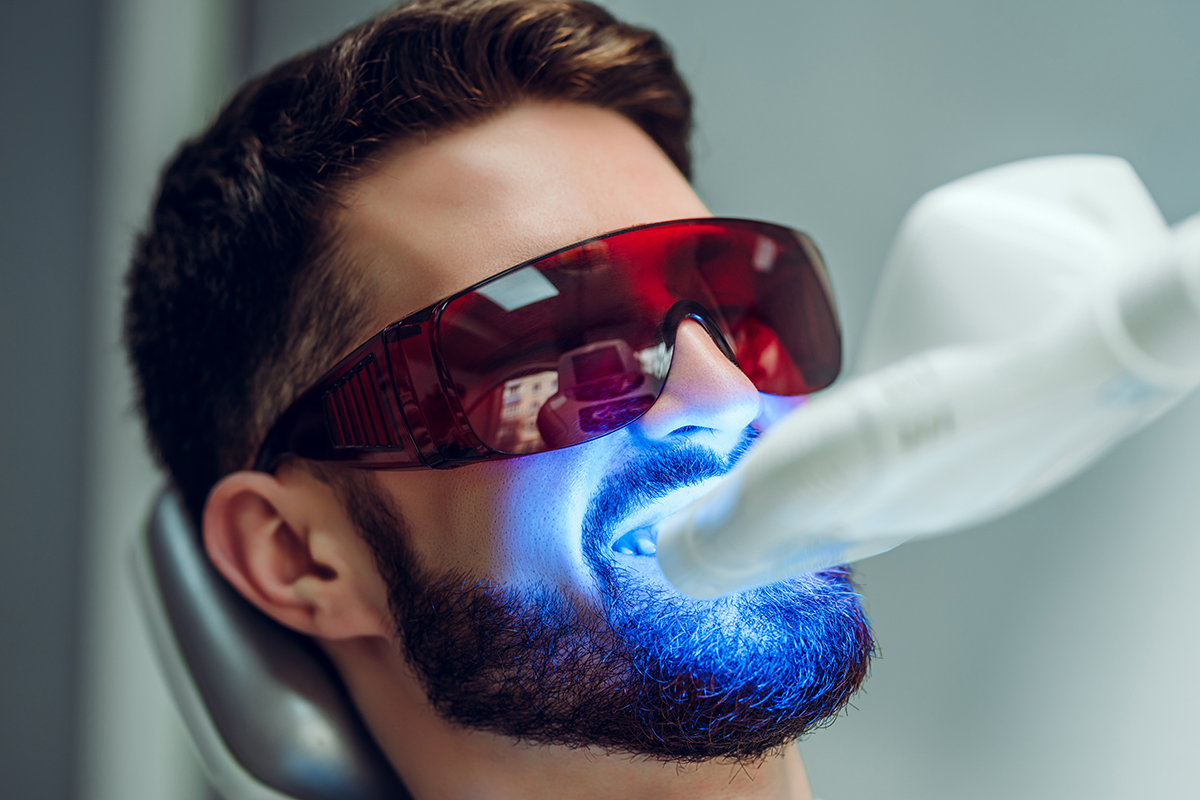 teeth whitening options (6) man getting teeth whitening options at dentist