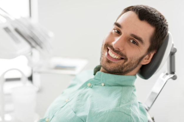 a man happy that he found a family dentist