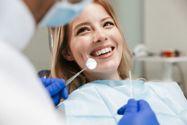 a woman talking to her doctor about gum disease