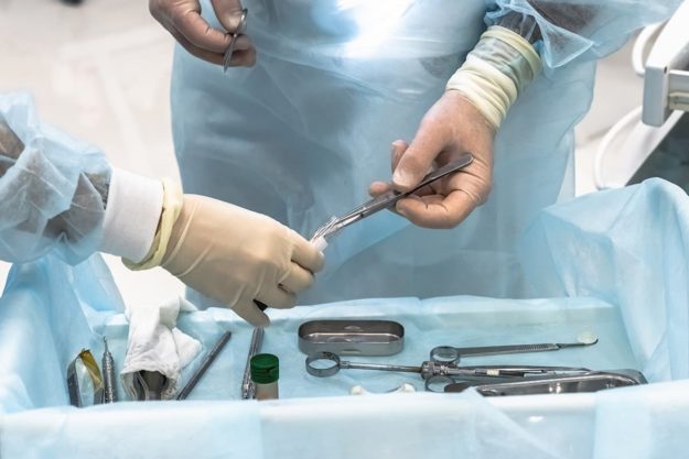 a dental team getting ready to perform bone grafting