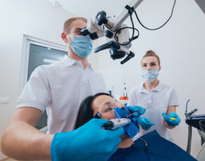 a doctor performing tooth extraction