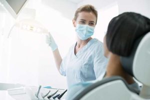 an emergency dentist performs work on a patient