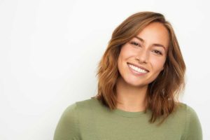 a woman benefits from teeth whitening