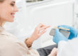 woman picks out dental implants
